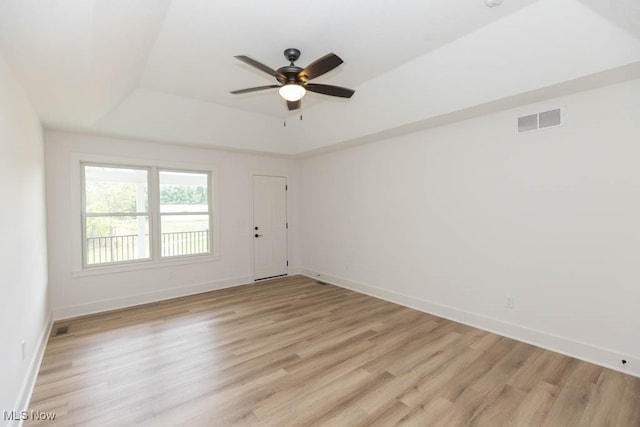 empty room featuring light hardwood / wood-style flooring and ceiling fan