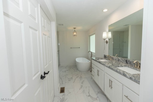 bathroom featuring vanity and separate shower and tub