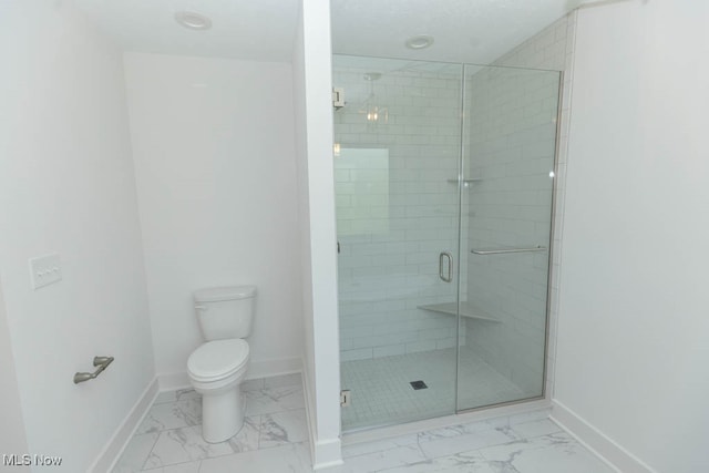 bathroom with walk in shower and toilet