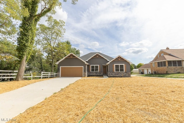 view of front facade featuring a front lawn and a garage