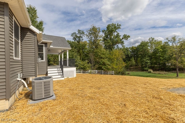 view of yard with central AC unit