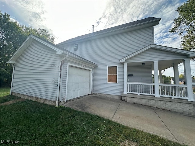 view of front of house featuring a garage and a porch