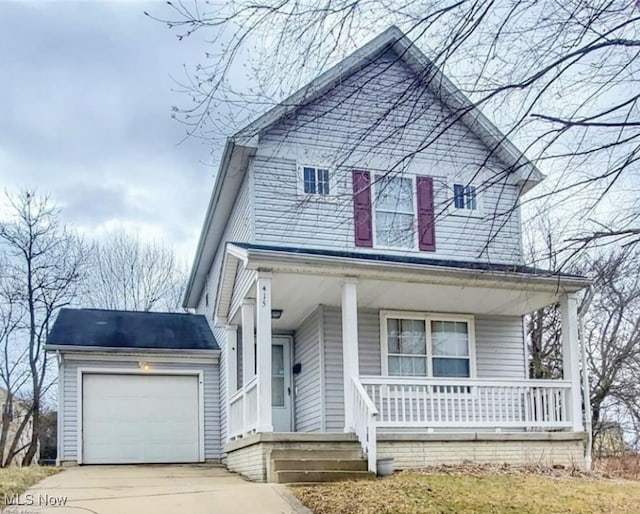 view of property featuring a garage and a porch