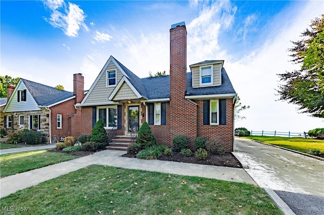 view of front of property with a front lawn