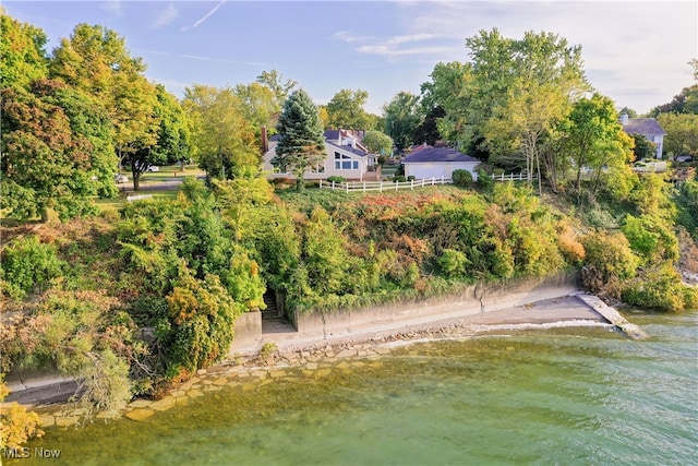 birds eye view of property with a water view