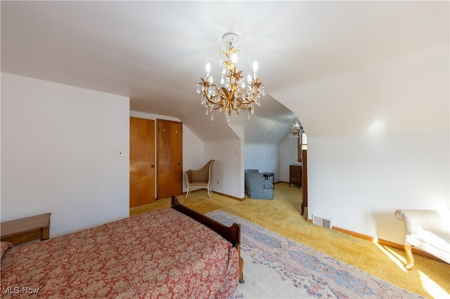 carpeted bedroom featuring a notable chandelier and vaulted ceiling