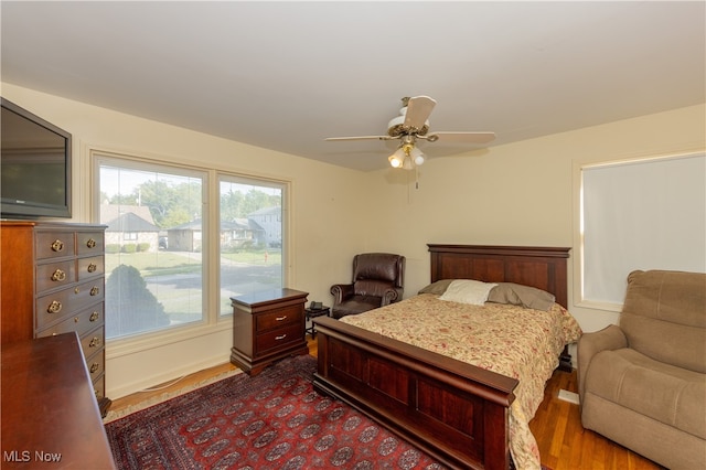 bedroom with hardwood / wood-style flooring and ceiling fan