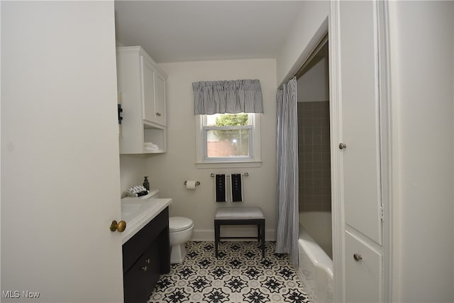 full bathroom featuring shower / bath combination with curtain, vanity, and toilet