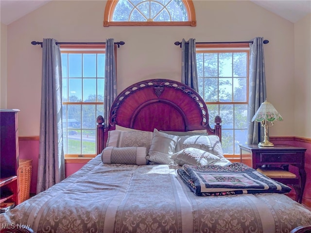 bedroom featuring lofted ceiling