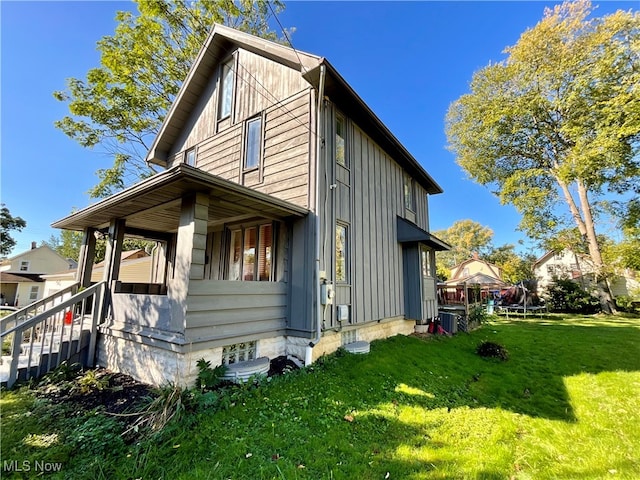 view of property exterior featuring central air condition unit and a lawn