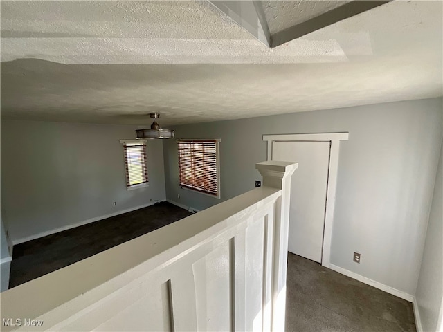 interior space featuring a textured ceiling