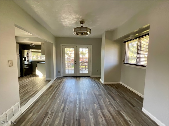 entryway with french doors and dark hardwood / wood-style flooring