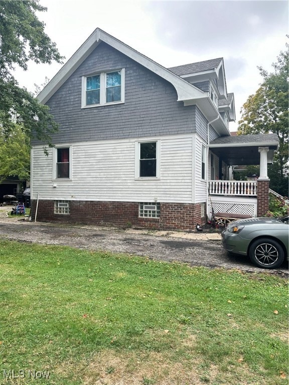 view of home's exterior featuring a yard