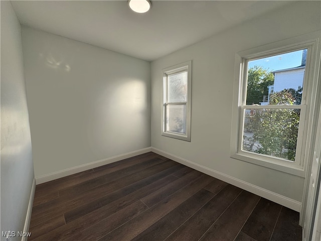 spare room featuring dark hardwood / wood-style floors