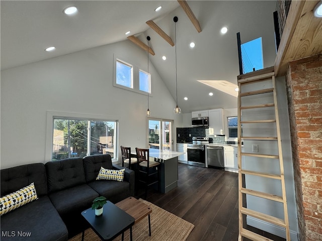 living room featuring dark wood-type flooring and high vaulted ceiling