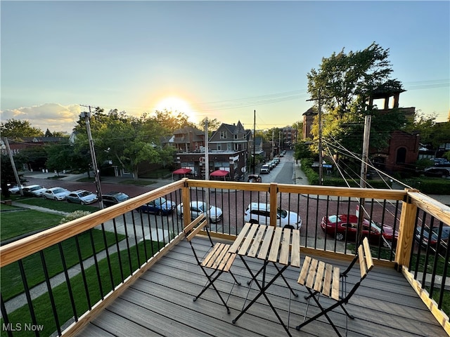 deck at dusk with a yard