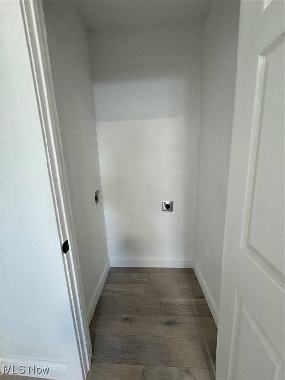 clothes washing area with hookup for an electric dryer and dark hardwood / wood-style flooring