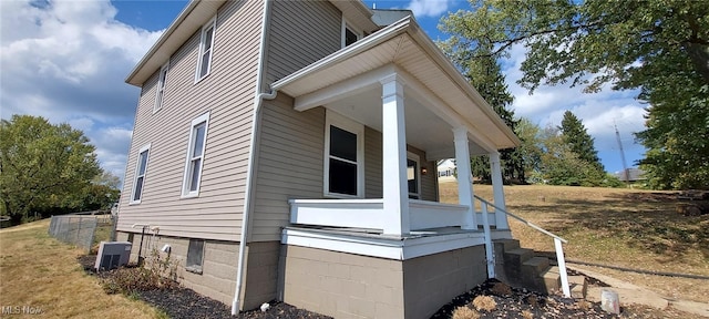 view of side of home featuring cooling unit