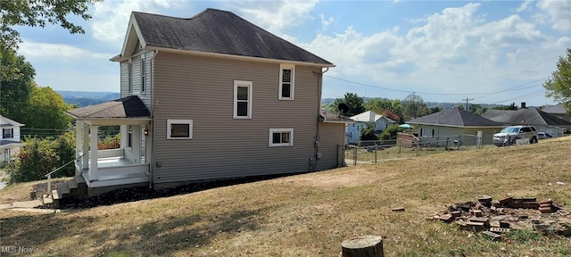 back of house with a yard