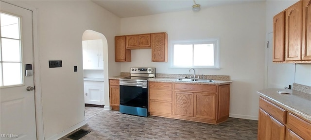 kitchen with stainless steel electric range oven and sink