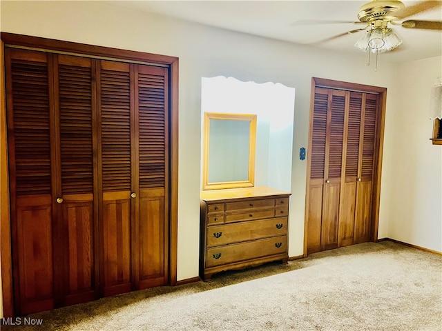 unfurnished bedroom featuring carpet and ceiling fan