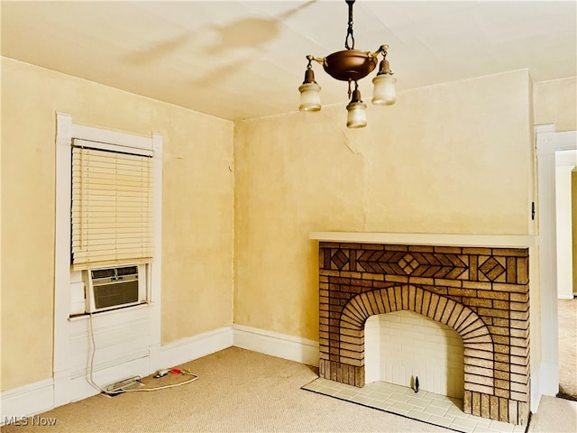 unfurnished living room featuring cooling unit and carpet