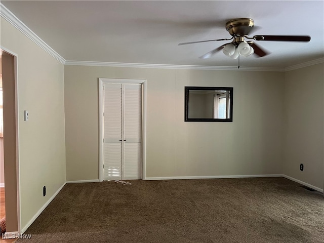 unfurnished room with ornamental molding, ceiling fan, and carpet floors