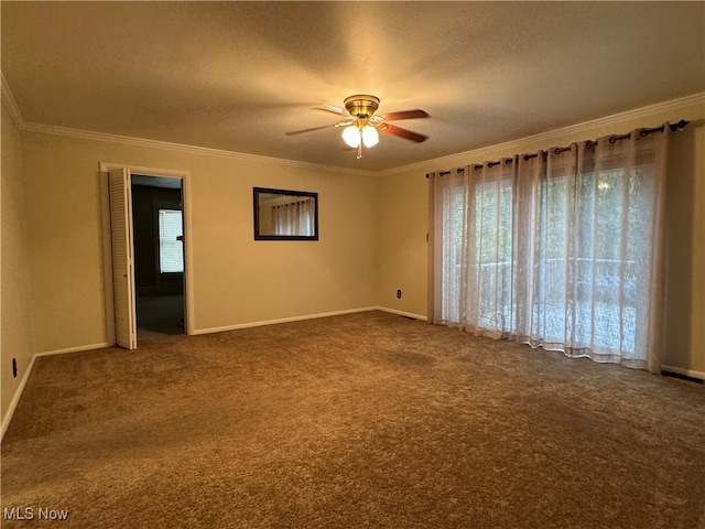 carpeted spare room featuring ceiling fan, crown molding, and a textured ceiling