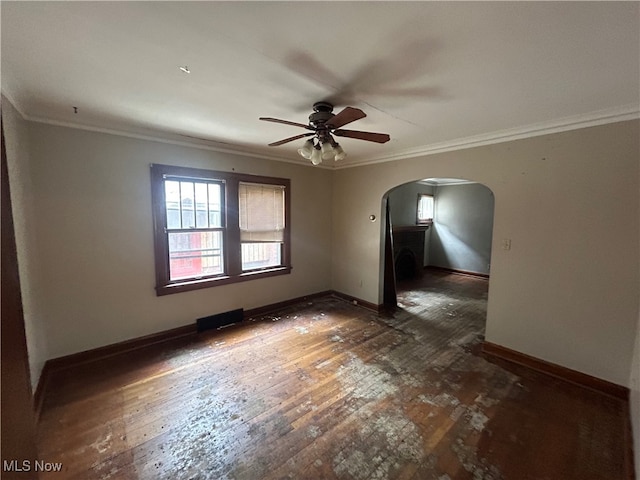 spare room with ceiling fan, crown molding, and dark hardwood / wood-style flooring