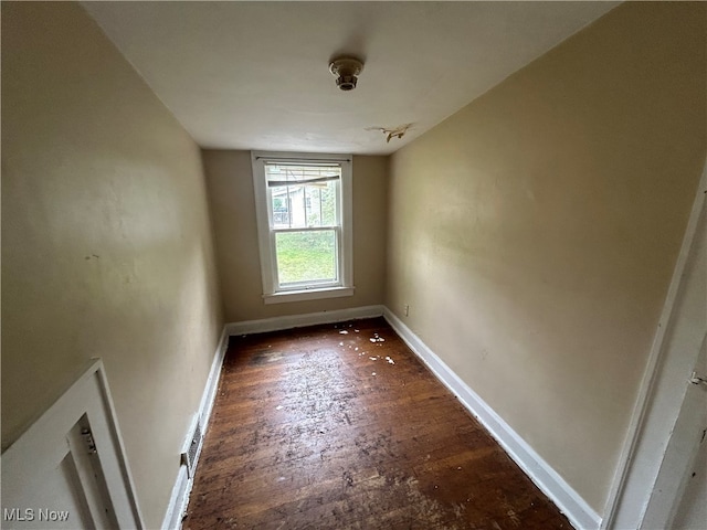 empty room featuring dark hardwood / wood-style floors