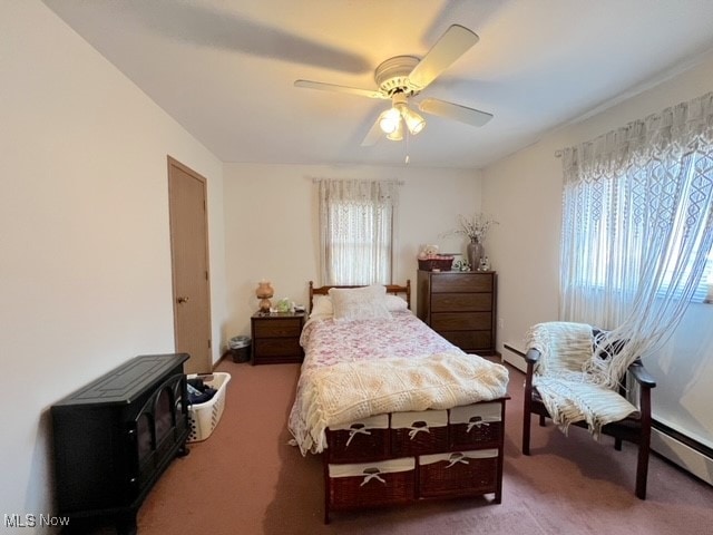 bedroom with multiple windows, carpet floors, and ceiling fan