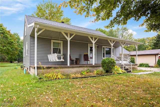 view of front facade with a front yard and covered porch