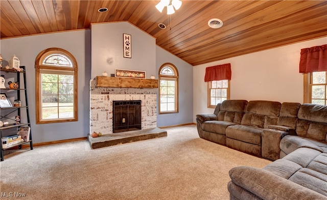 carpeted living room with wooden ceiling, a healthy amount of sunlight, and vaulted ceiling