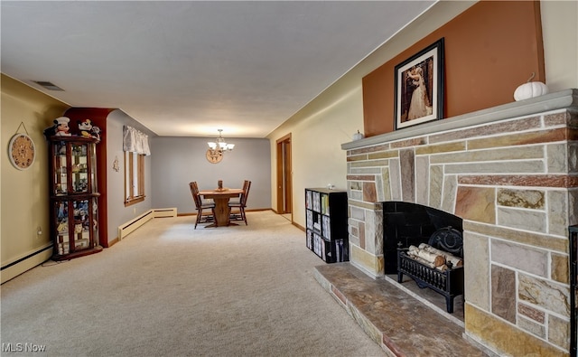 carpeted living room featuring a stone fireplace, an inviting chandelier, and baseboard heating