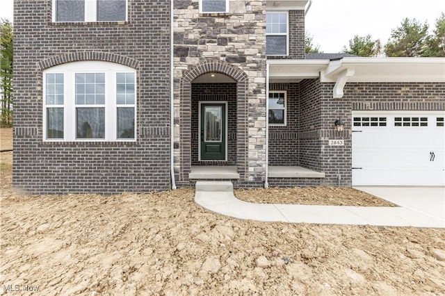 doorway to property featuring a garage