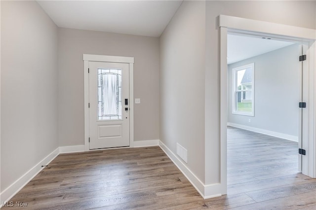 foyer entrance with light hardwood / wood-style floors