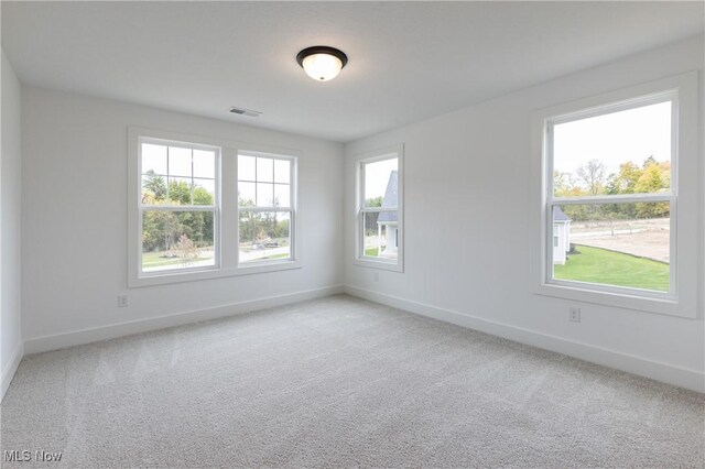 empty room featuring carpet flooring