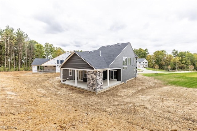 back of property with a patio area