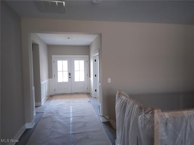 doorway featuring hardwood / wood-style floors and french doors