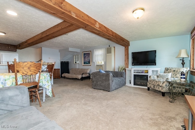 carpeted living room with a textured ceiling and beam ceiling