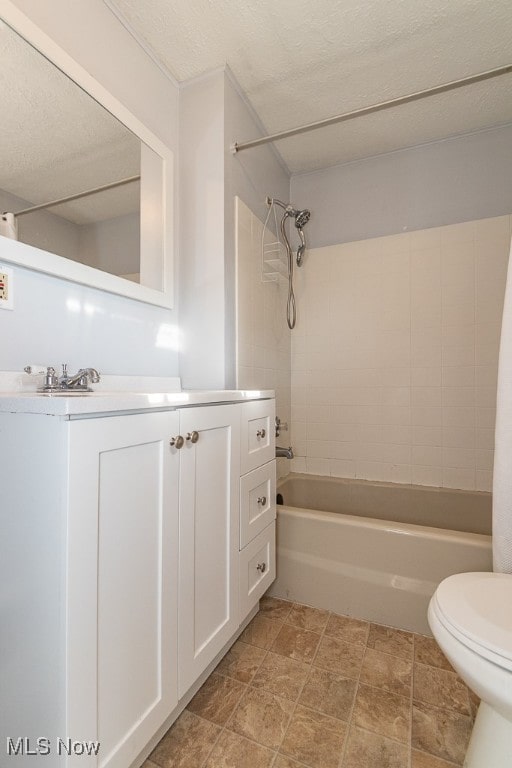 full bathroom with a textured ceiling, vanity, toilet, and shower / bathtub combination with curtain