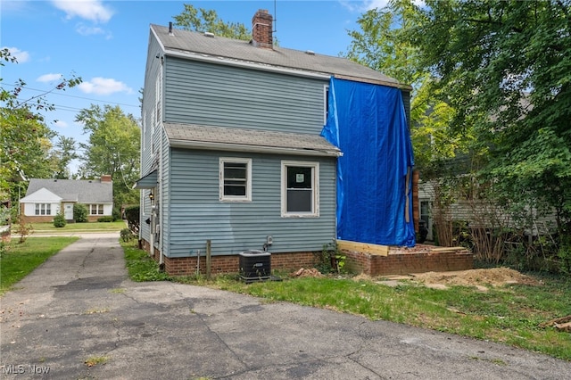 view of property exterior featuring central AC