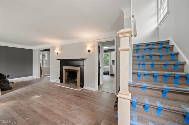 unfurnished living room featuring wood-type flooring