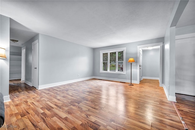 interior space featuring light hardwood / wood-style floors and a textured ceiling