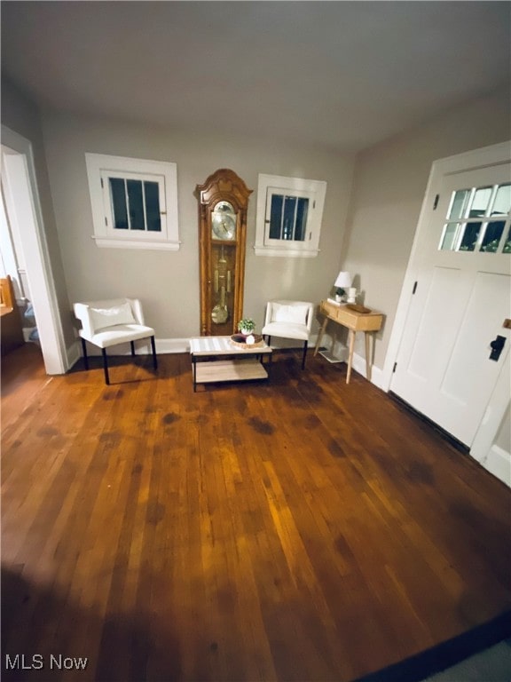 unfurnished room with dark hardwood / wood-style flooring