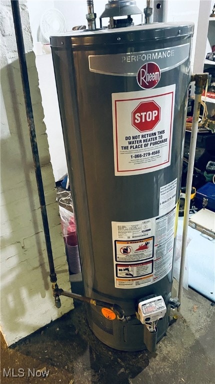 utility room featuring gas water heater