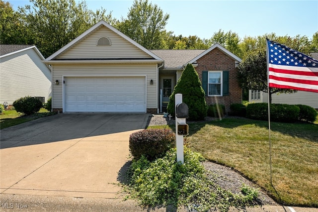 single story home with a front yard and a garage