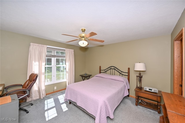 bedroom featuring light carpet and ceiling fan