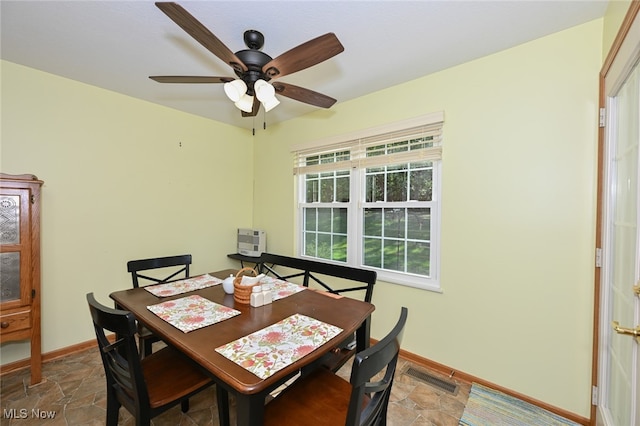 dining space featuring ceiling fan