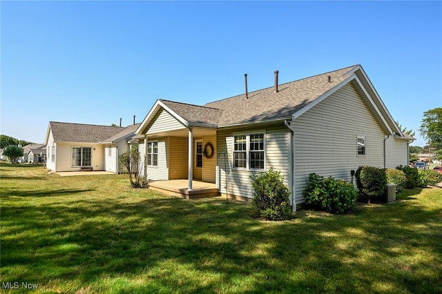 exterior space featuring a patio, central AC, and a yard